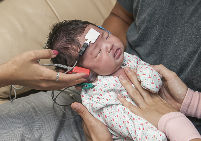 Infant receiving hearing screen.
