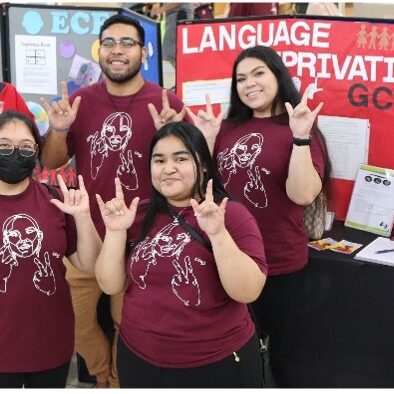 Students from the Guam Community College (GCC) American Sign Language (ASL) program pose for a quick photo showing the “I Love You” sign in ASL during the Guam EHDI Fair.